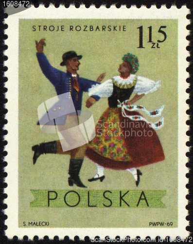 Image of Polish folk dancers from Rozbarskie region on post stamp