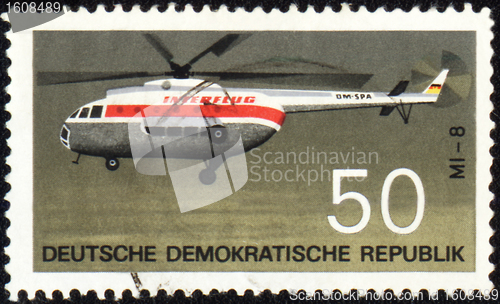 Image of Flying helicopter Mi-8 on post stamp