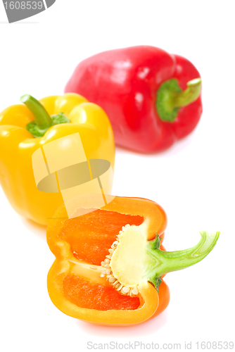 Image of Orange, yellow and red bell peppers