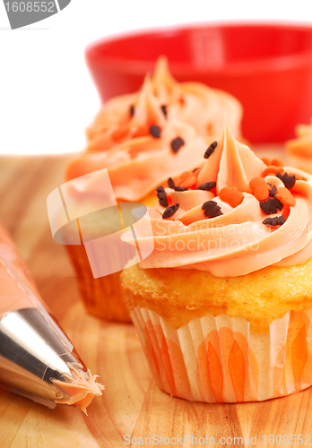 Image of Halloween cupcakes being frosted
