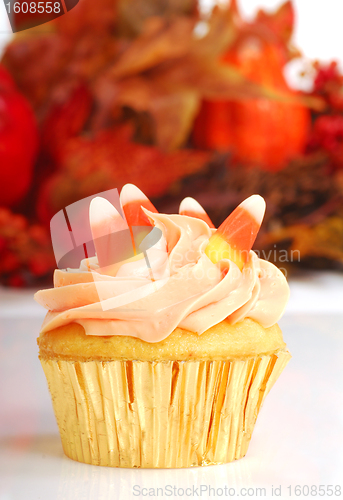 Image of Halloween cupcake with fall foliage