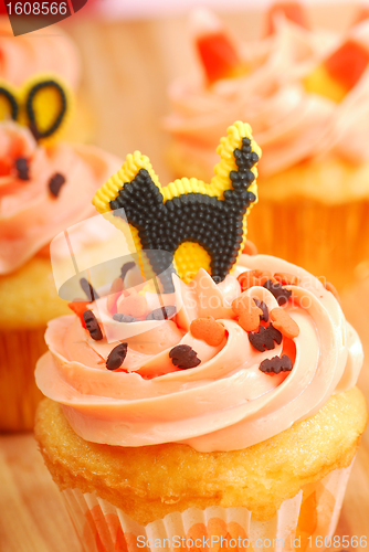 Image of Halloween cupcakes being frosted