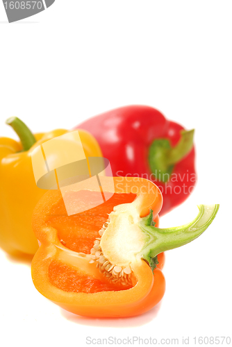 Image of Orange, yellow and red bell peppers