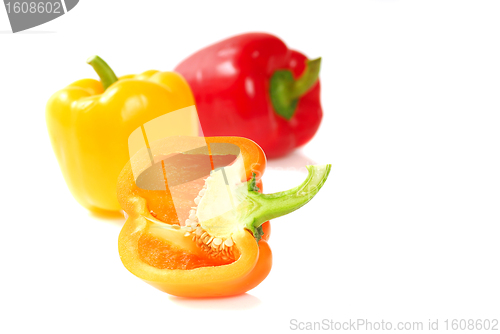 Image of Orange, yellow and red bell peppers