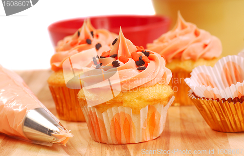 Image of Halloween cupcakes being frosted