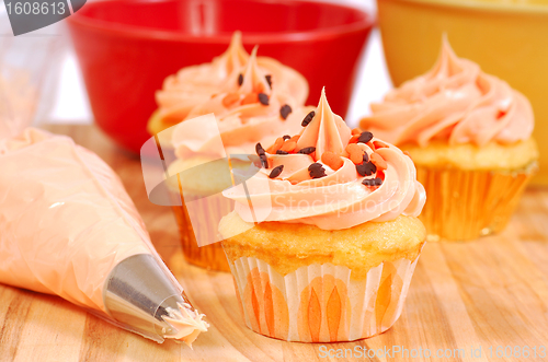 Image of Halloween cupcakes being frosted