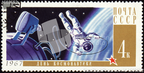 Image of Postage stamp with Cosmonaut in open space