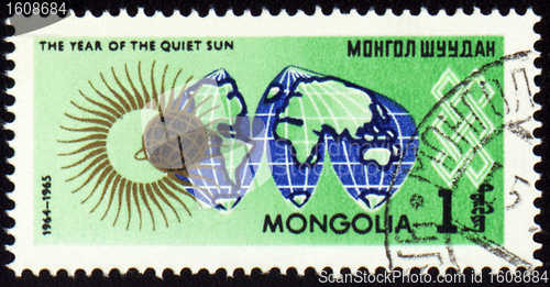 Image of Post stamp with map Globe and symbol of the Sun
