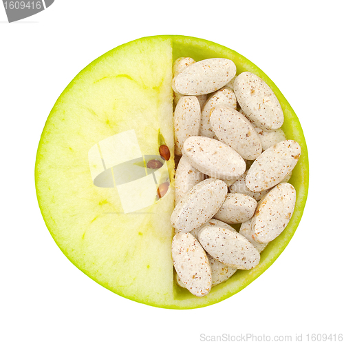 Image of Close up of apple and pills isolated 