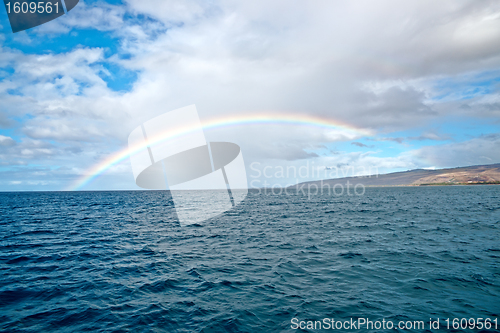 Image of Kauai Island shore and the rainbow