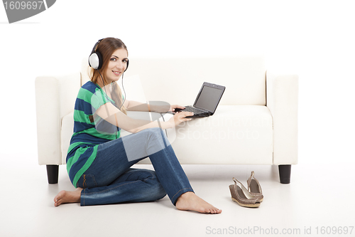 Image of Listen music and using  a laptop
