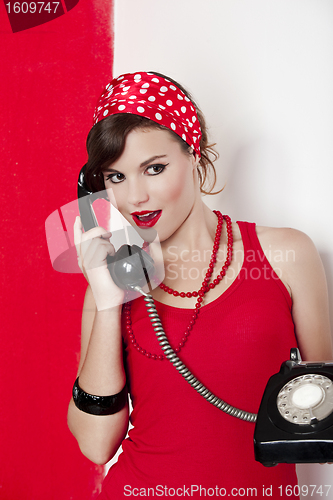 Image of Girl with a vintage phone
