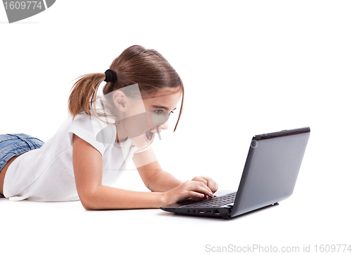 Image of Little student girl with a laptop