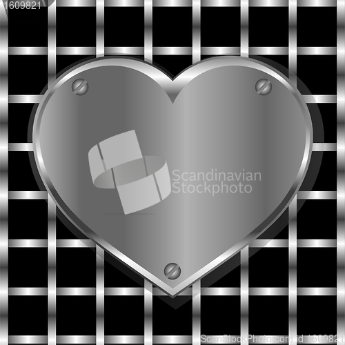Image of Brushed metal heart on a perforated metal background