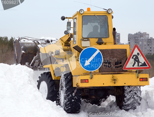 Image of Tractor cleaning snow drifts