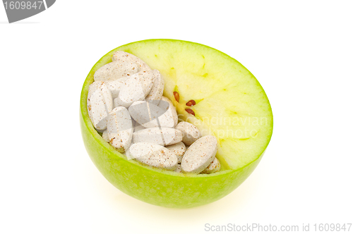 Image of Close up of apple and pills isolated 