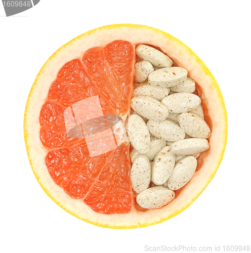 Image of Close up of red grapefruit and pills isolated