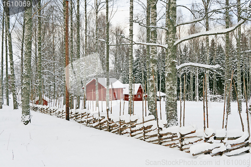 Image of Red wooden houses in a snowy landscape