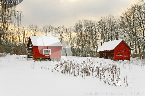 Image of Old red houses in a winter landscape