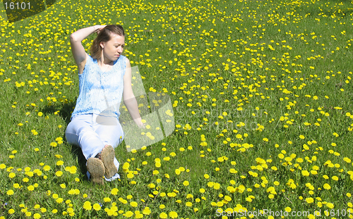 Image of Girl on dandelion lawn