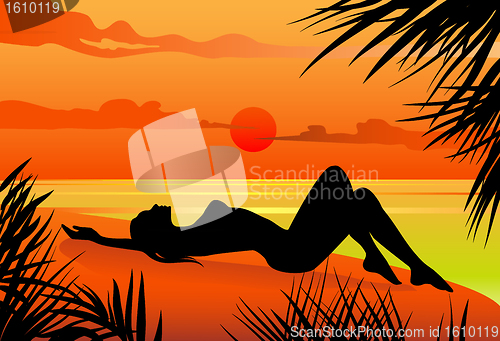 Image of Girl lying on the beach silohuette
