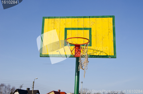 Image of Basketball basket tattered bow mesh background sky 