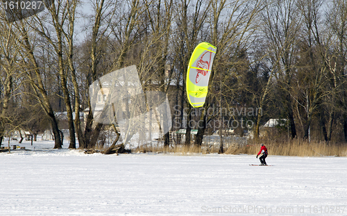 Image of Man kiteboarding frozen lake winter active 