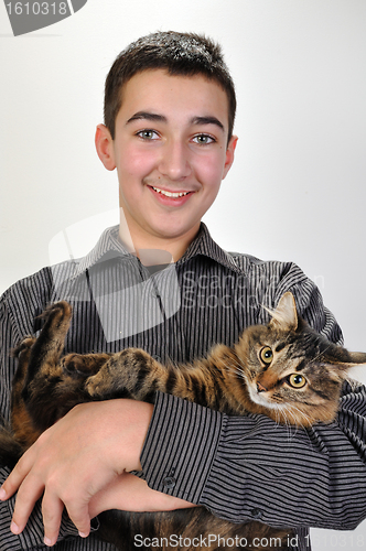 Image of smiling teeage boy with a cat