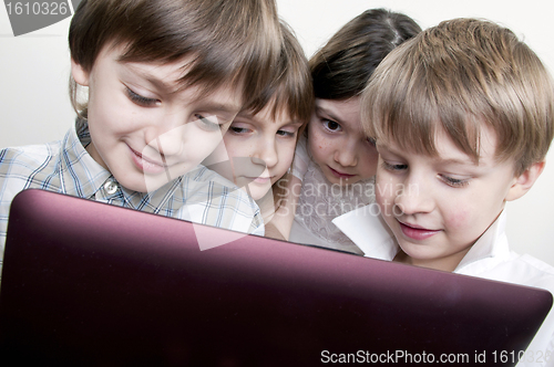 Image of group of children friends playing computer games