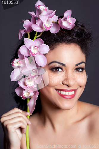 Image of Pretty Woman with Orchid Flower