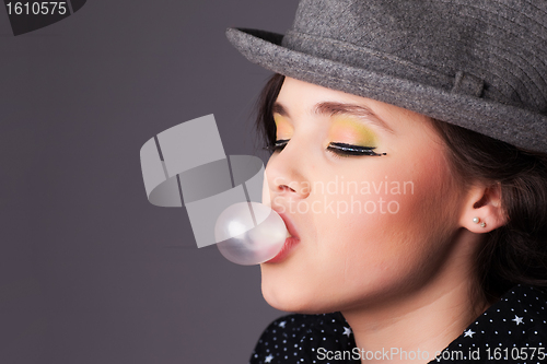 Image of Girl Making a Bubble Portrait