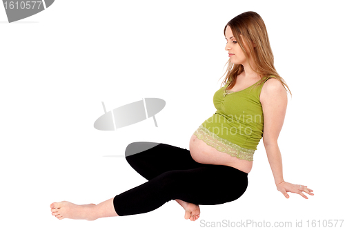 Image of Pregnant Woman Sitting on the Ground