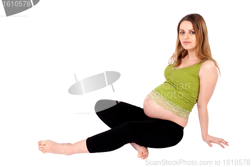 Image of Pregnant Woman Sitting on the Ground