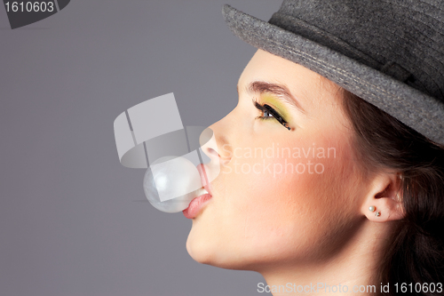 Image of Girl Making a Bubble Side View Portrait