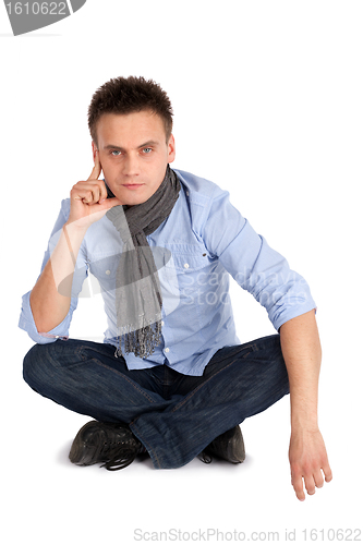 Image of Thoughtful Man Sitting with Legs Crossed