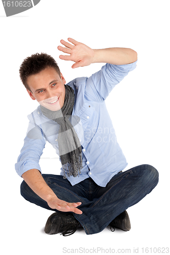 Image of Cheerful Casual Man Sitting