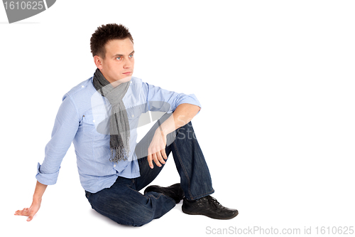 Image of Casual Man Sitting on the ground