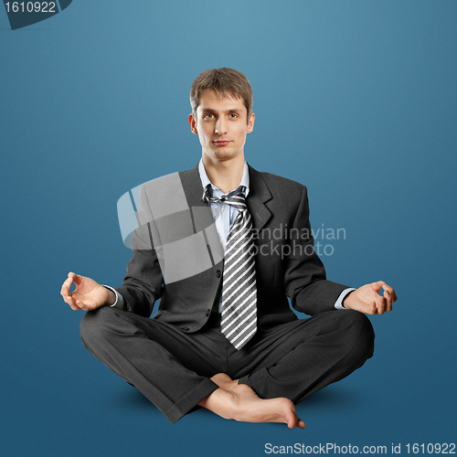 Image of businessman in lotus pose