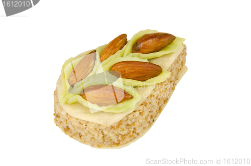 Image of pastry ornamented with almonds isolated
