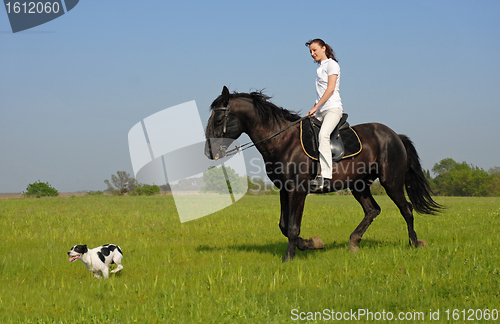Image of riding girl and her dog