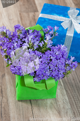 Image of Spring bouquet  campanula blue and gift box, a close up