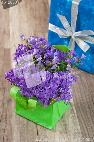 Image of Spring bouquet  campanula blue and gift box, a close up