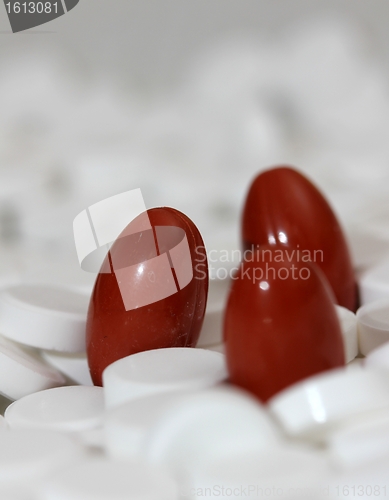 Image of three red capsules