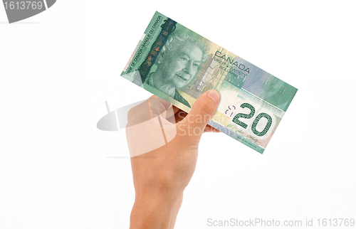 Image of Hand Holding 20 Dollar Bill