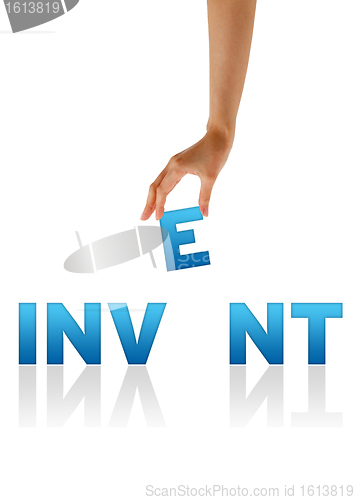 Image of Hand holding E of the word Invent