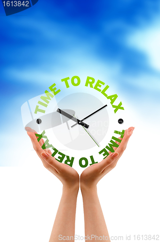 Image of Hands holding a relax clock