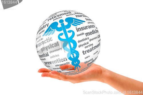 Image of Hand holding a Caduceus Sphere