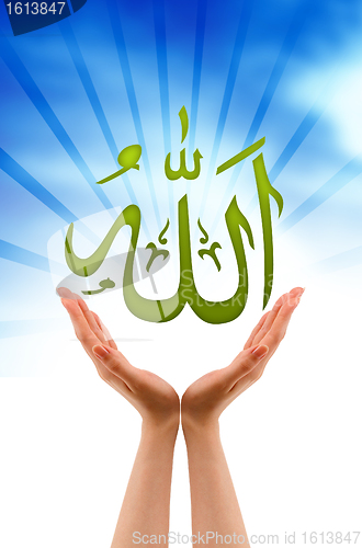 Image of Hand holding a Allah sign
