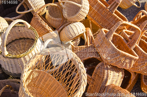 Image of Handmade basket bags stacked pile sell fair market 