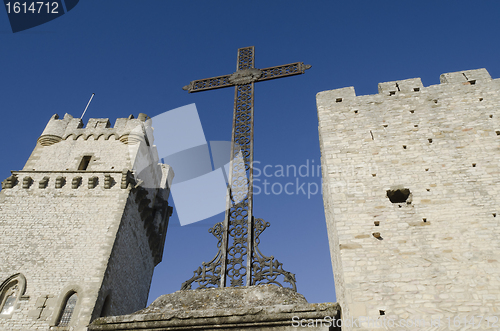 Image of cross between two medieval towers